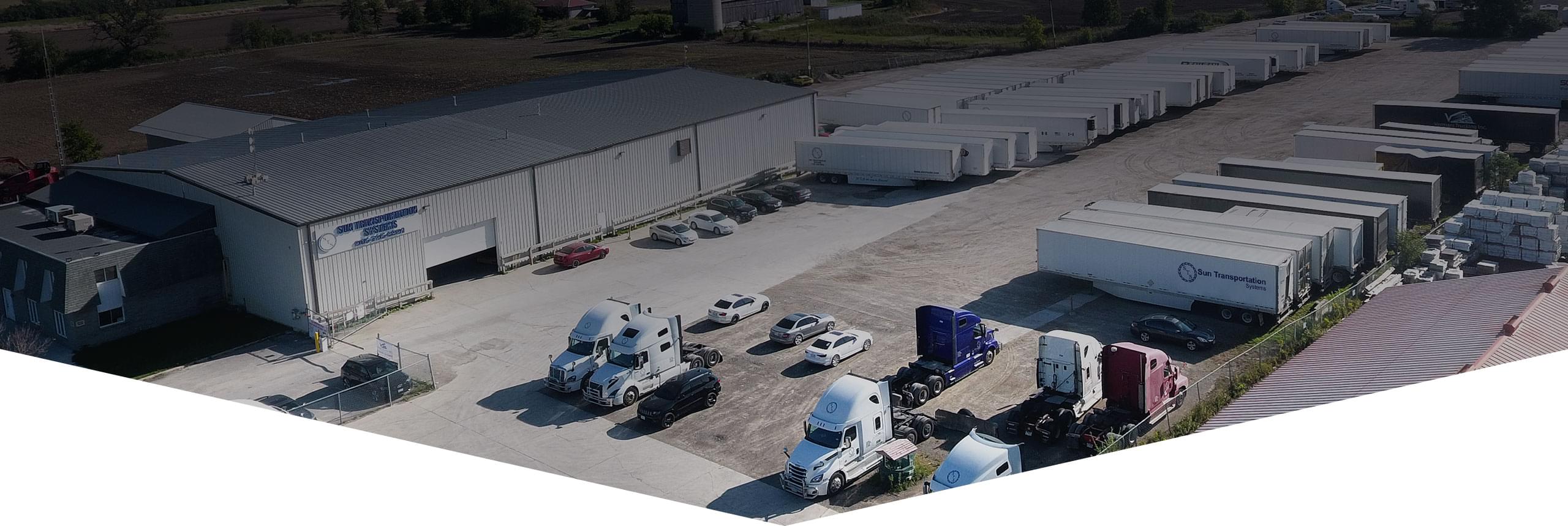 An aerial view of STS property, with building, vehicles, trucks, trailers and equipment available to lease.